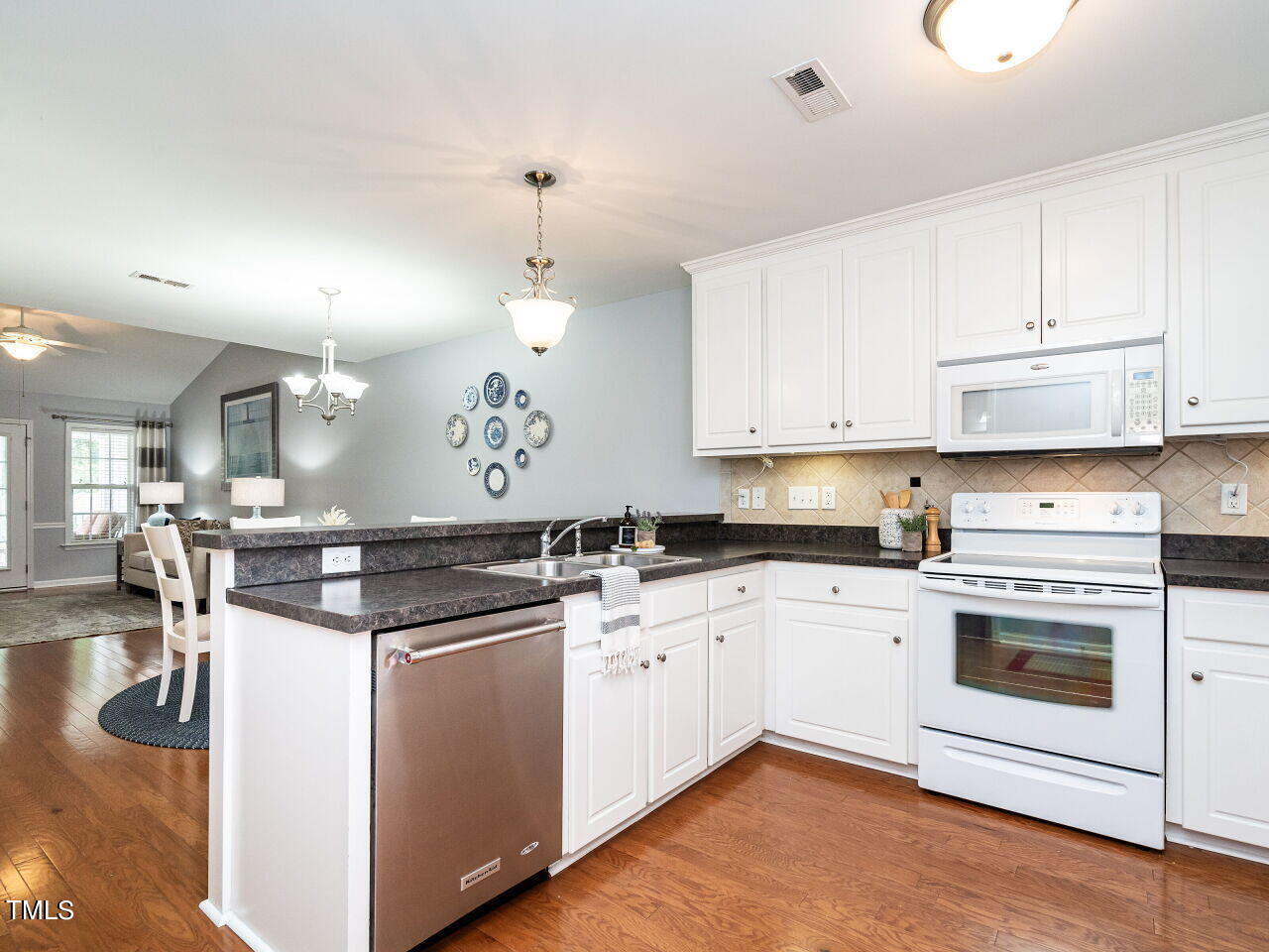585 Pinecroft Drive Clayton, NC 27520 - Photo 4 of 26 a kitchen with a sink and cabinets