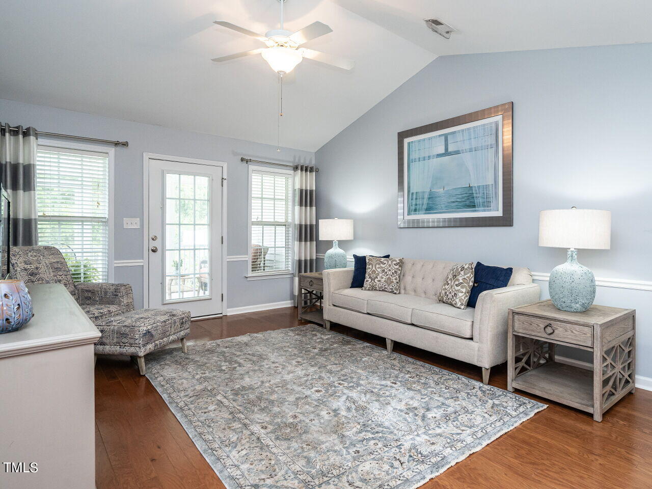 585 Pinecroft Drive Clayton, NC 27520 - Photo 10 of 26 a living room with furniture and a large window