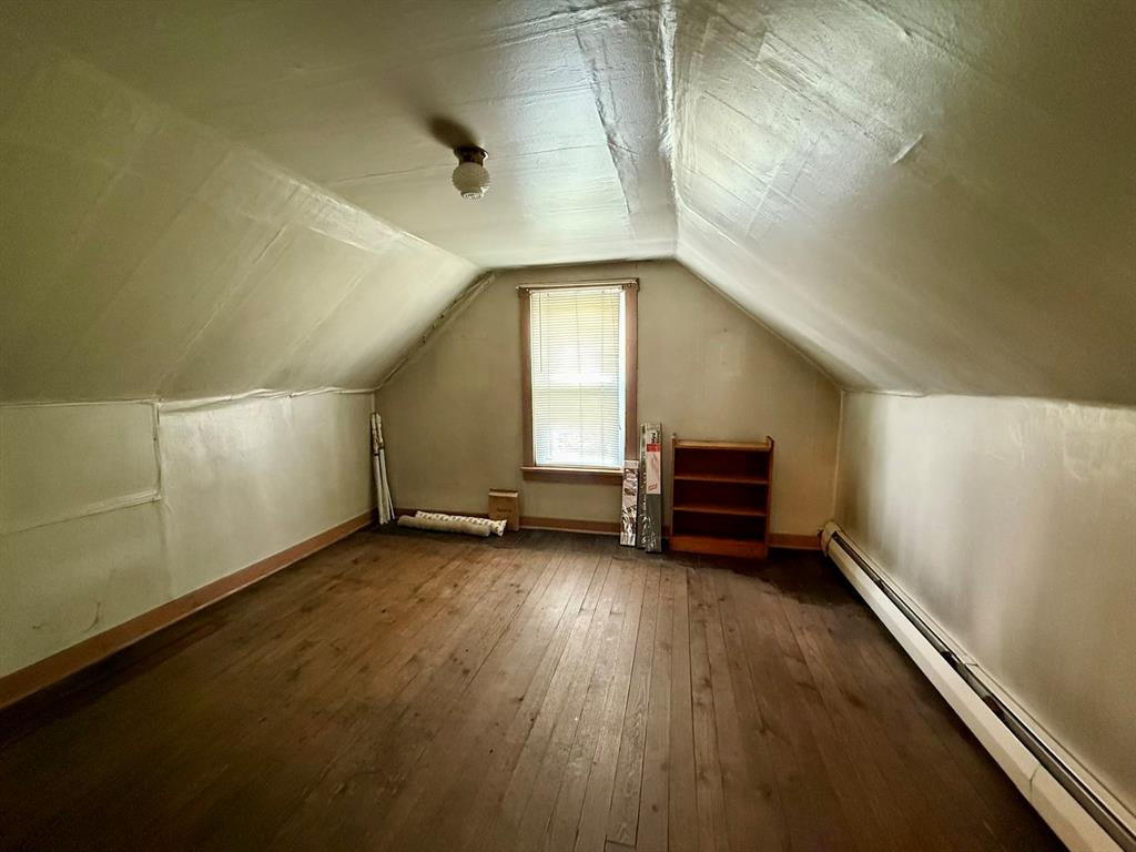 222 Bagdad Road Leechburg, PA 15656 - Photo 20 of 23 an empty room with wooden floor and windows