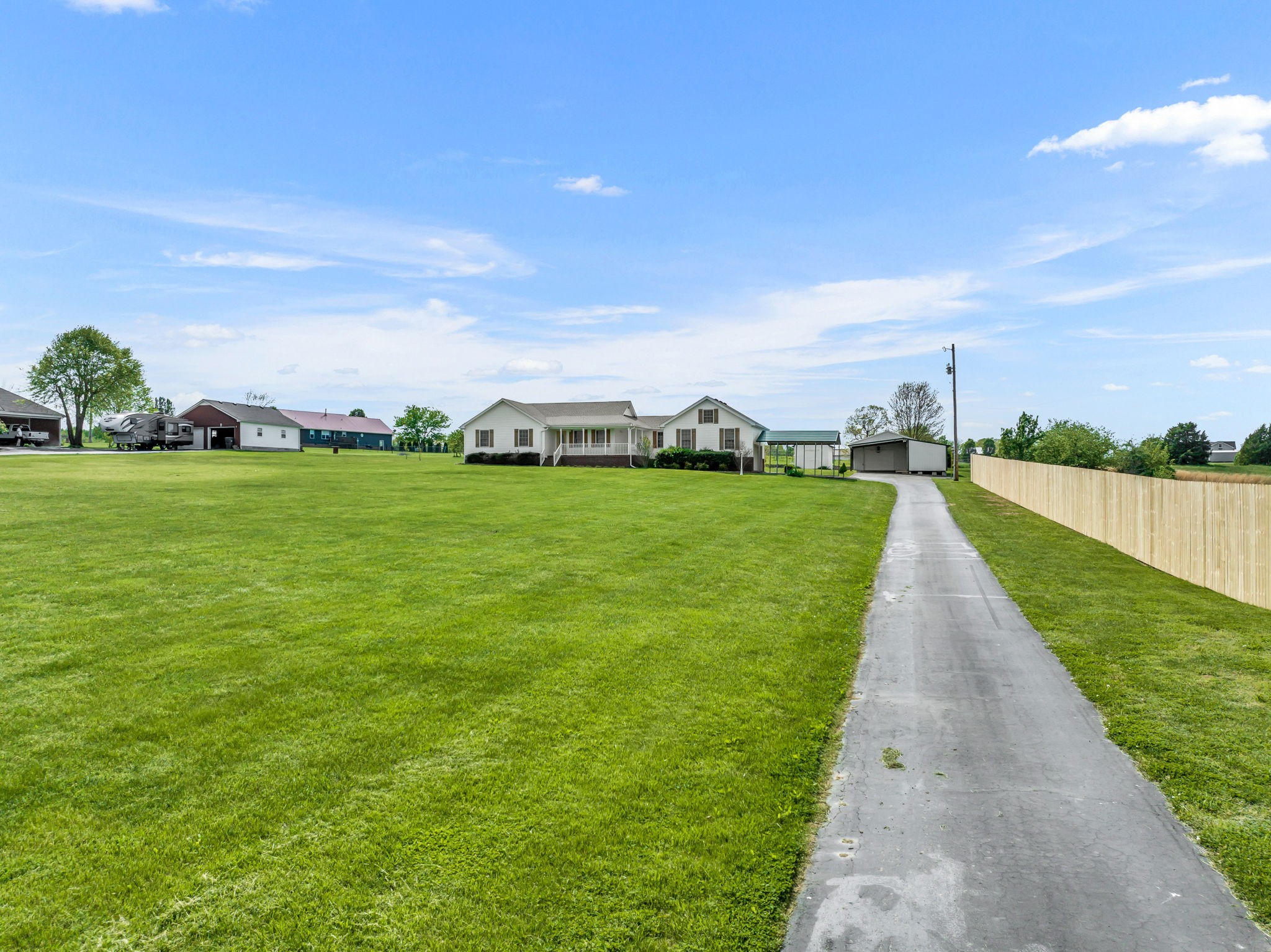 257 Martin Chapel Road Portland, TN 37148 - Photo 3 of 36 a view of a grassy field with an trees
