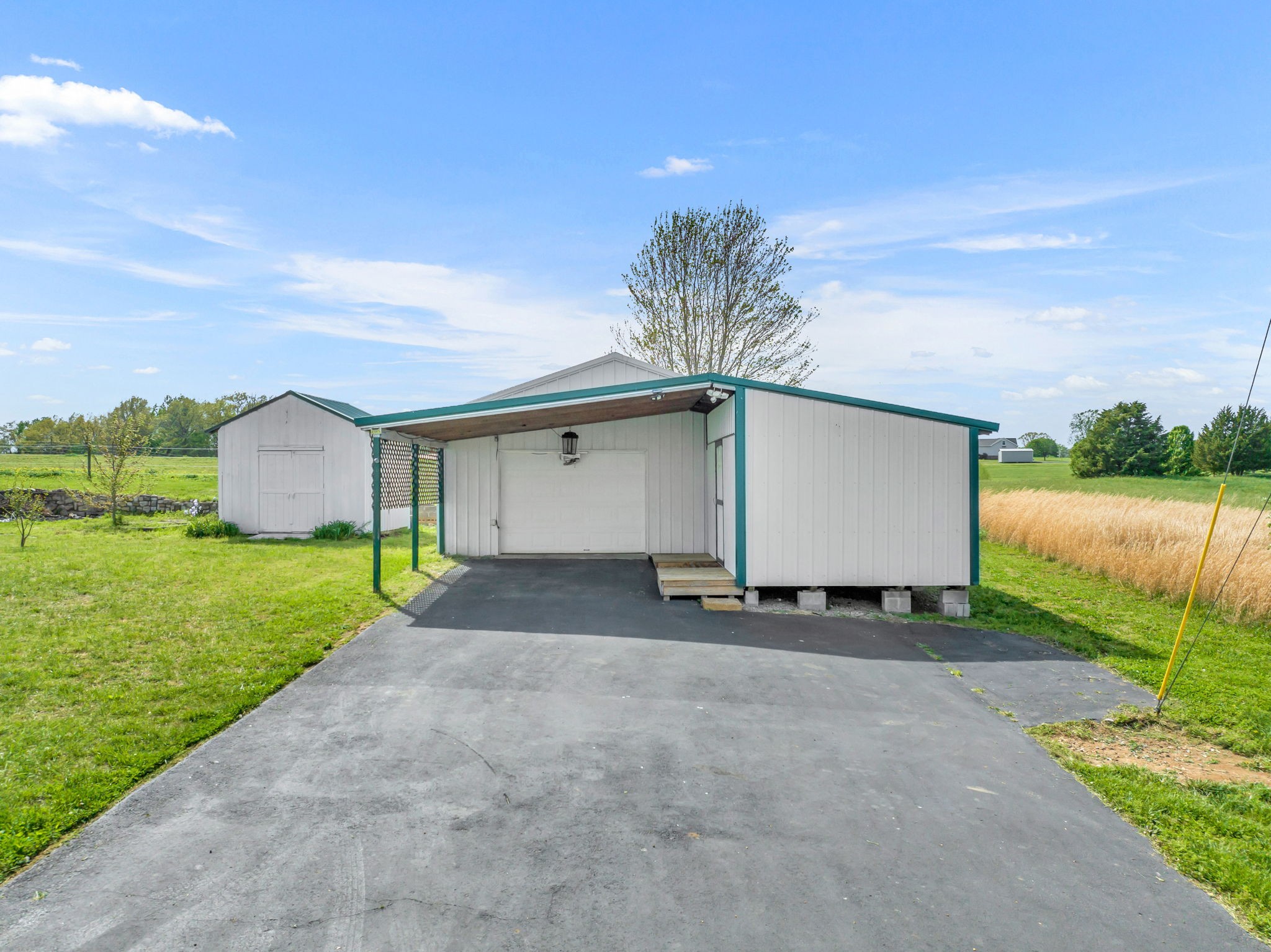 257 Martin Chapel Road Portland, TN 37148 - Photo 8 of 36 a front view of a house with a yard and garage