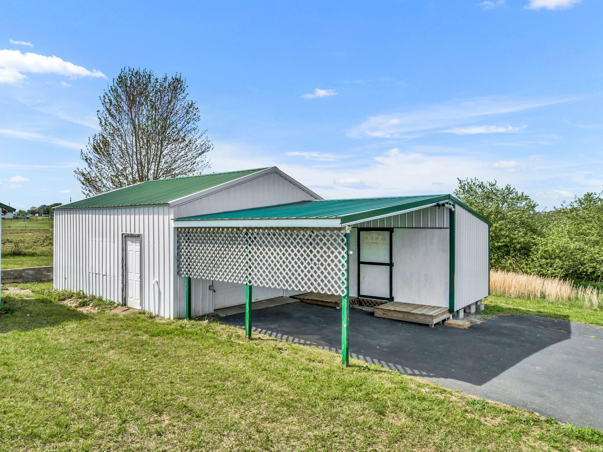 257 Martin Chapel Road Portland, TN 37148 - Photo 9 of 36 a view of a house with a yard and garage