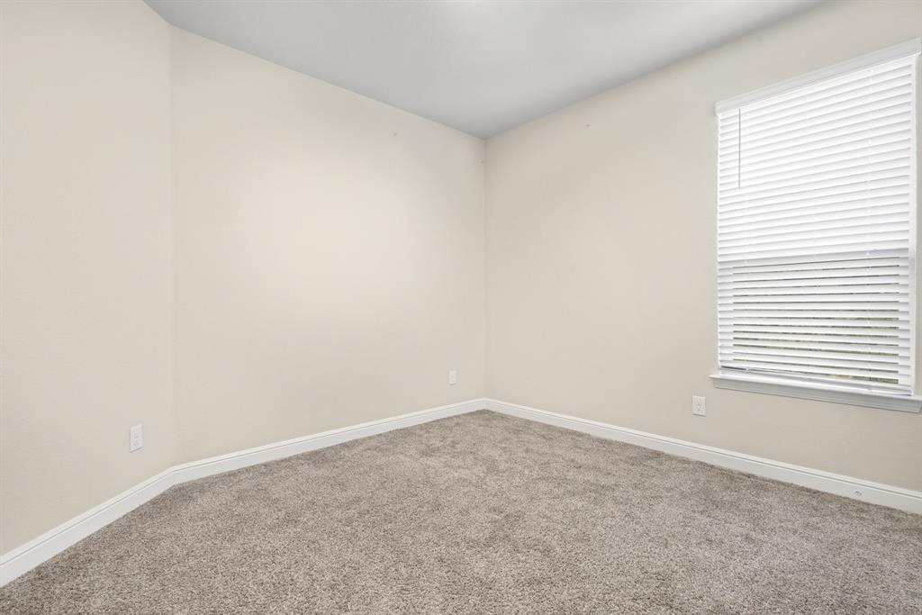 820 Wilmott Terrace Justin, TX 76247 - Photo 15 of 22 an empty room with a window