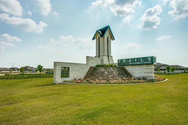 a view of an apartment with a garden