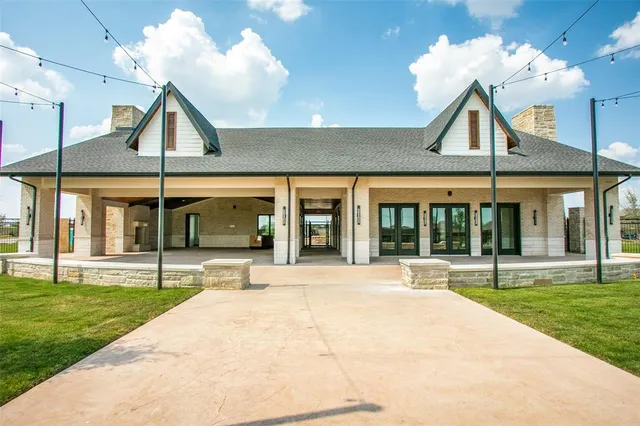 a view of a building with a yard and outdoor space