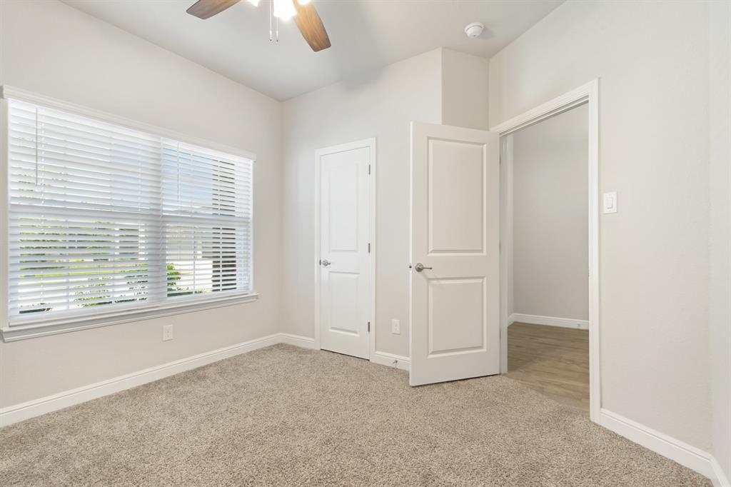 820 Wilmott Terrace Justin, TX 76247 - Photo 4 of 22 a view of an empty room with a window