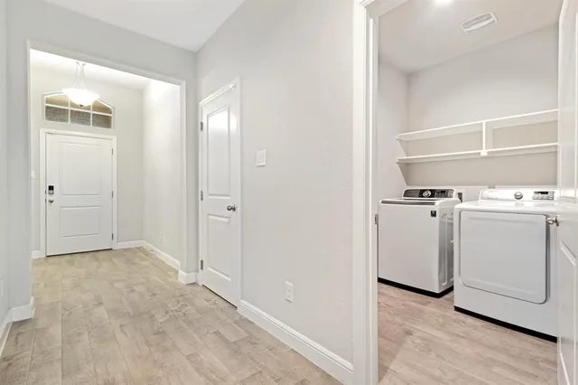 a kitchen with a sink a stove a microwave and cabinets