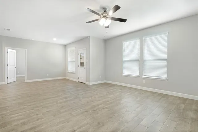 a bathroom with a double vanity sink and mirror