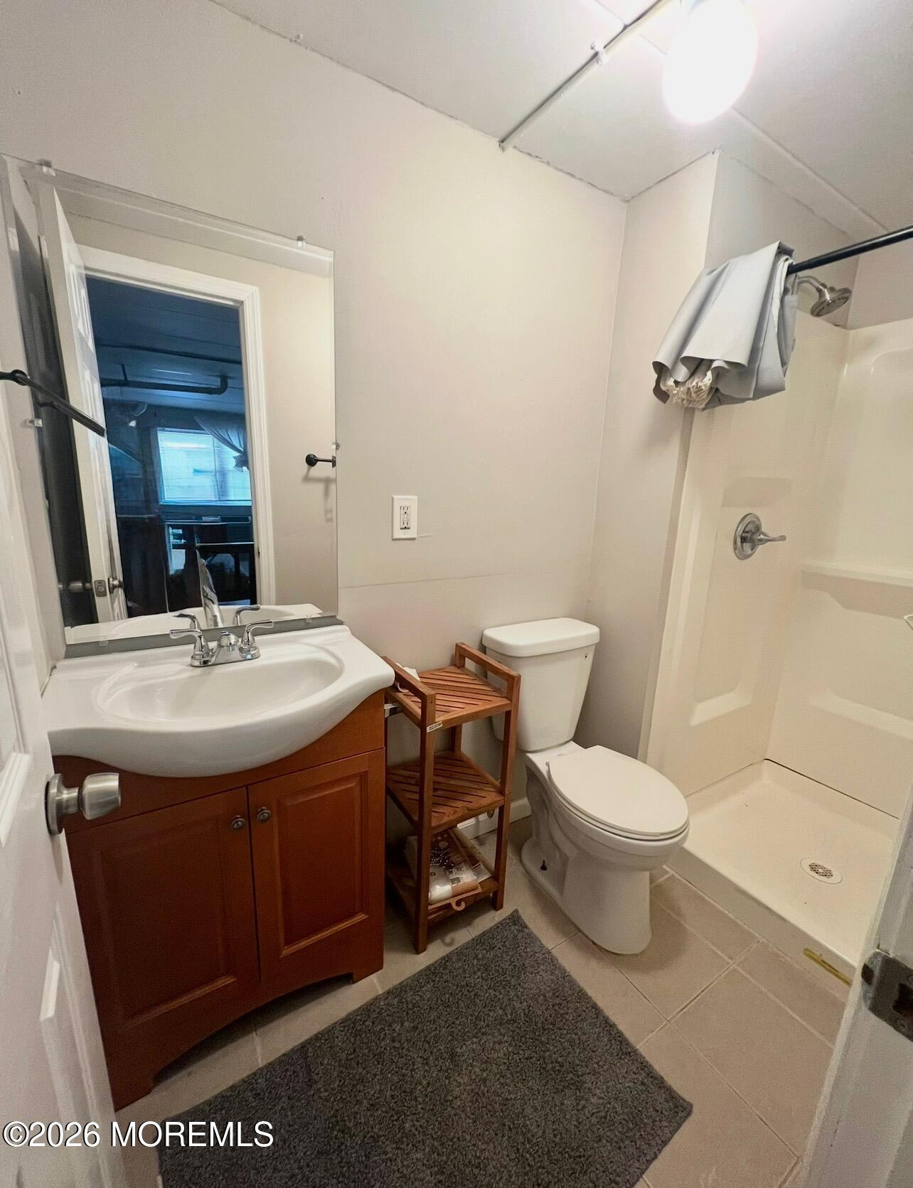 Ocean Terrace Seaside Heights, NJ 08751 - Photo 20 of 25 a bathroom with a sink toilet and shower