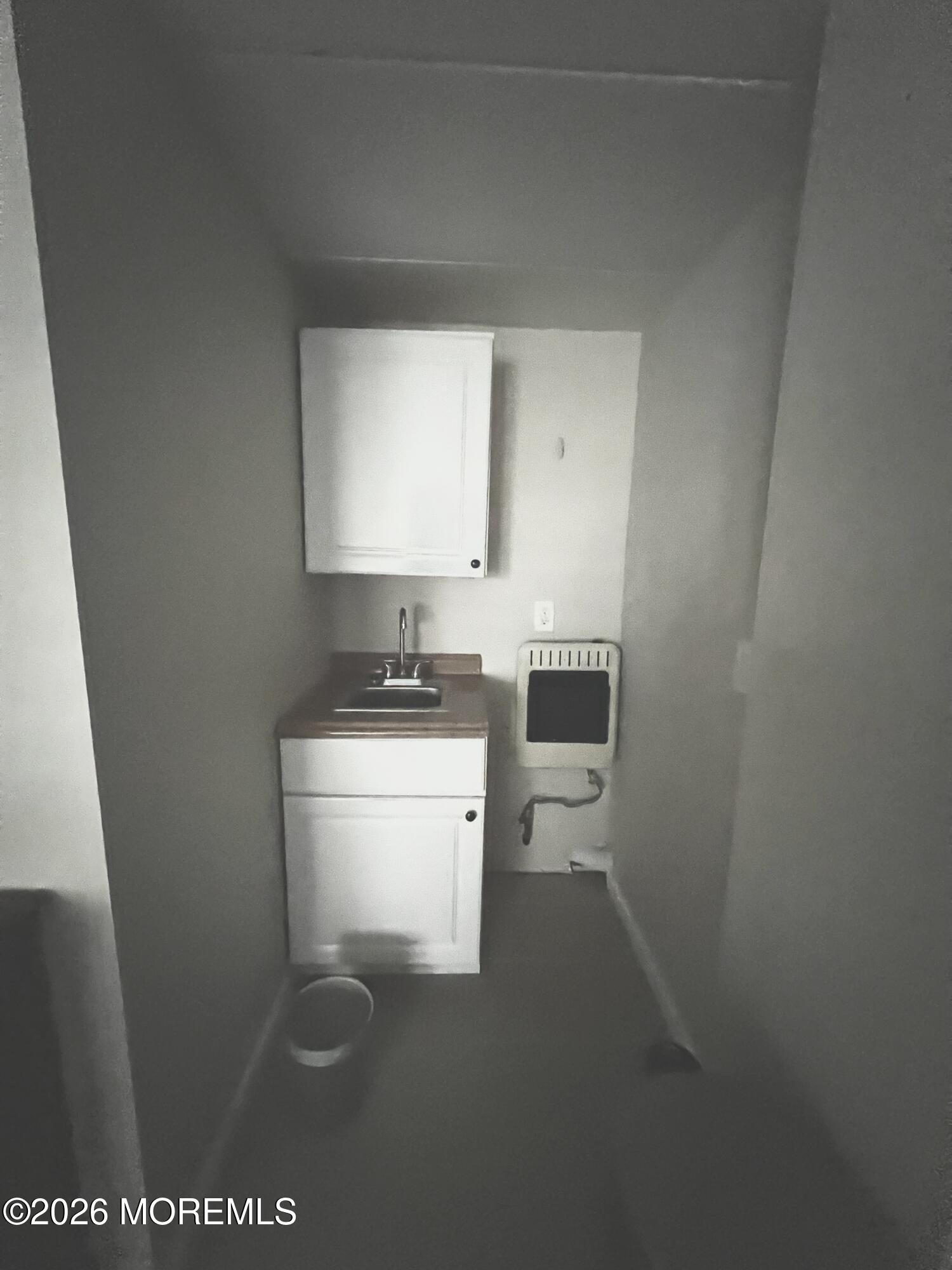 Ocean Terrace Seaside Heights, NJ 08751 - Photo 21 of 25 a bathroom with a sink a toilet and a mirror