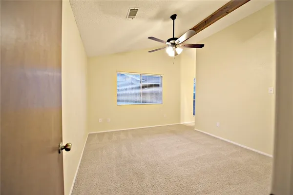a view of a big room with carpet