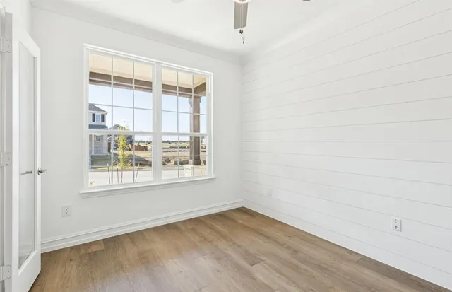 a kitchen with kitchen island granite countertop a sink a center island stainless steel appliances and cabinets