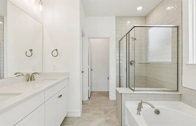 a bathroom with a sink double vanity and a mirror