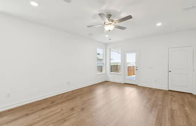a view of a kitchen with a sink and a refrigerator