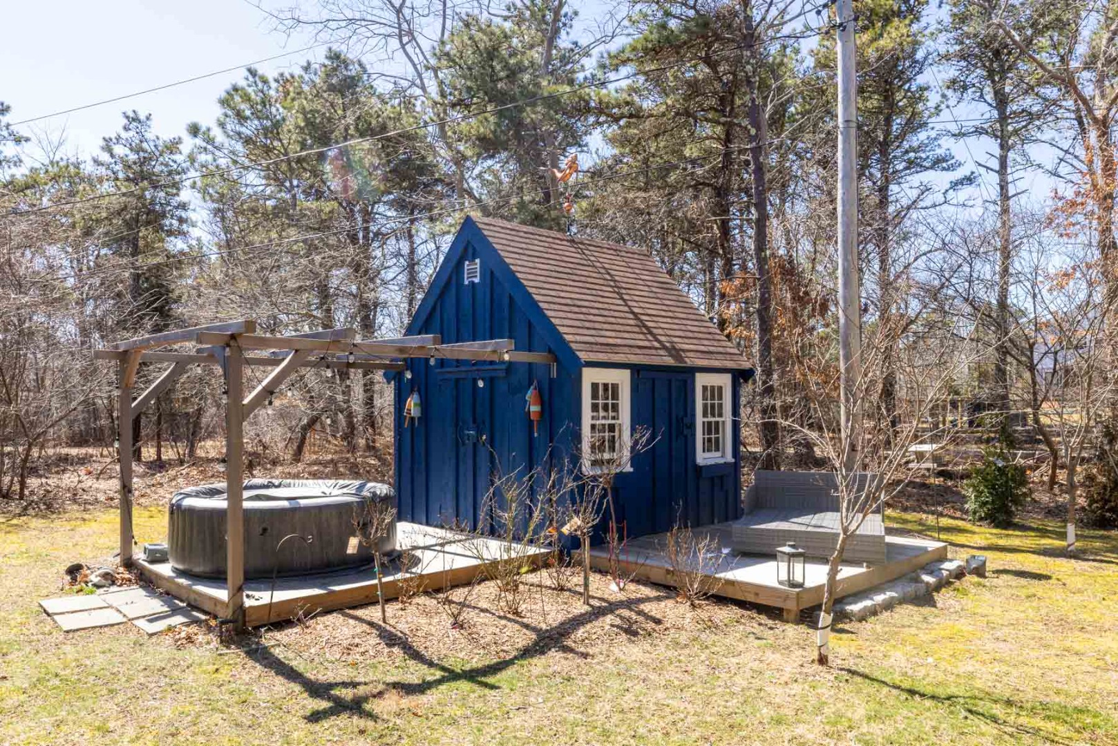 41 Rd To The Plaines Edgartown, MA 02539 - Photo 17 of 19 a patio with table and chairs and potted plants