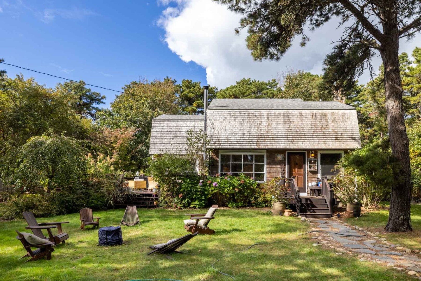 41 Rd To The Plaines Edgartown, MA 02539 - Photo 2 of 19 a view of a house with backyard porch and sitting area