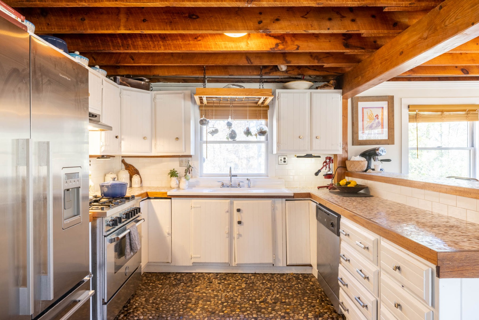 41 Rd To The Plaines Edgartown, MA 02539 - Photo 5 of 19 a kitchen with granite countertop a sink a window stainless steel appliances and cabinets