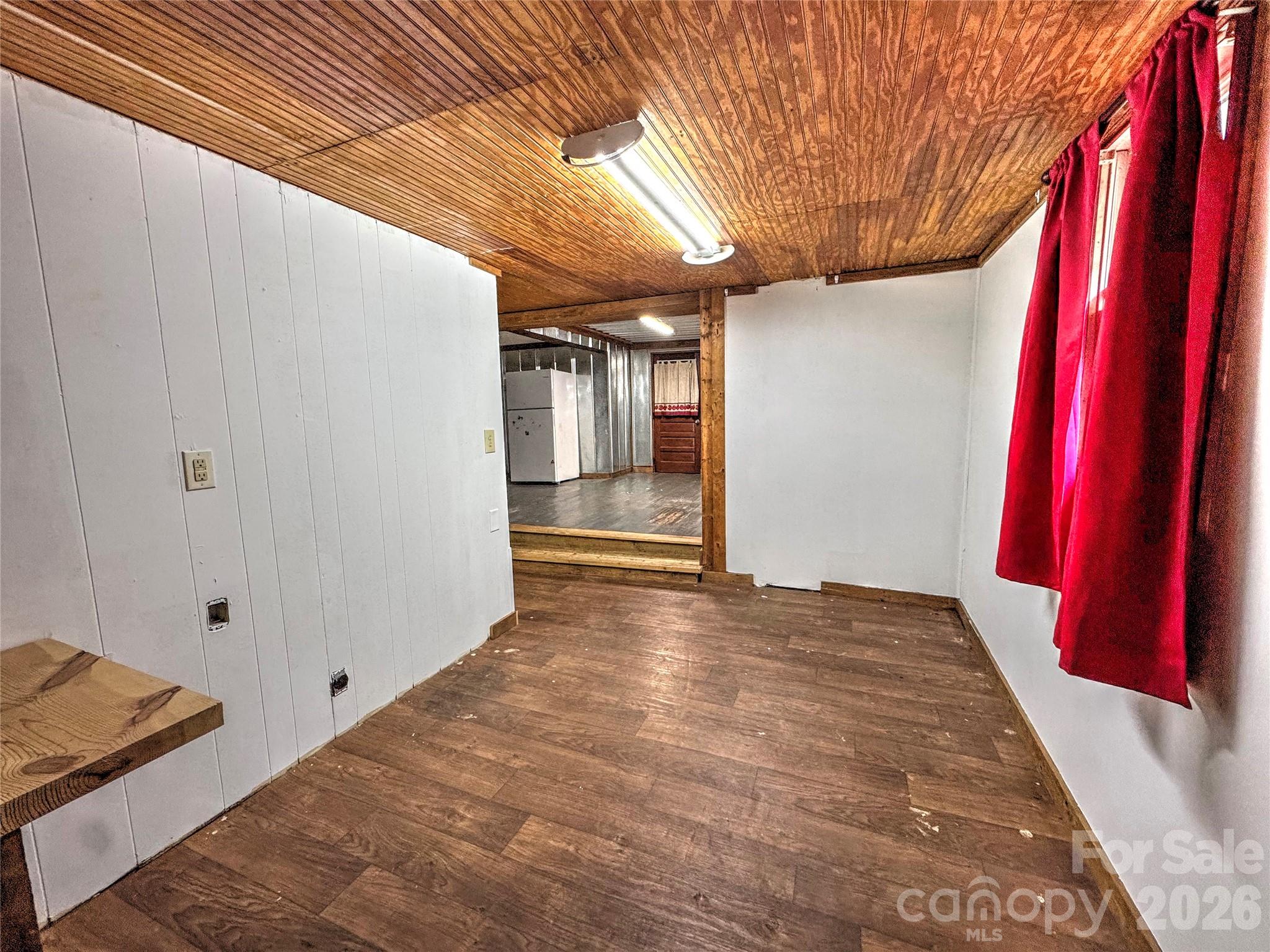 1101 Otter Creek Road Topton, NC 28781 - Photo 14 of 37 a view of a room with wooden walls and stairs