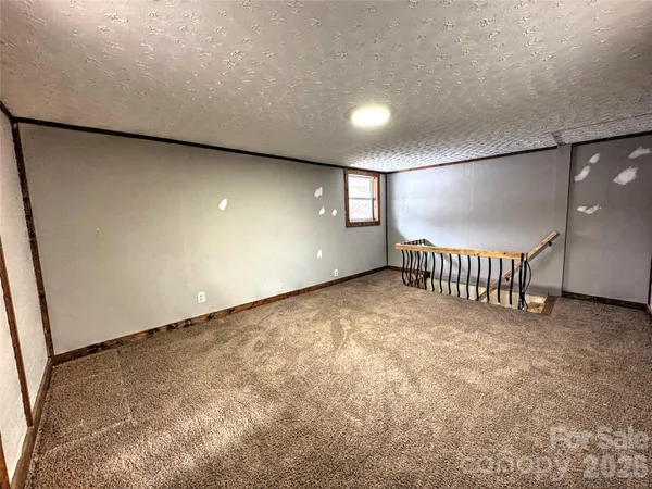 a view of an empty room with windows
