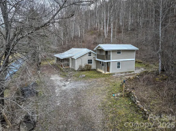 a house with trees in the background