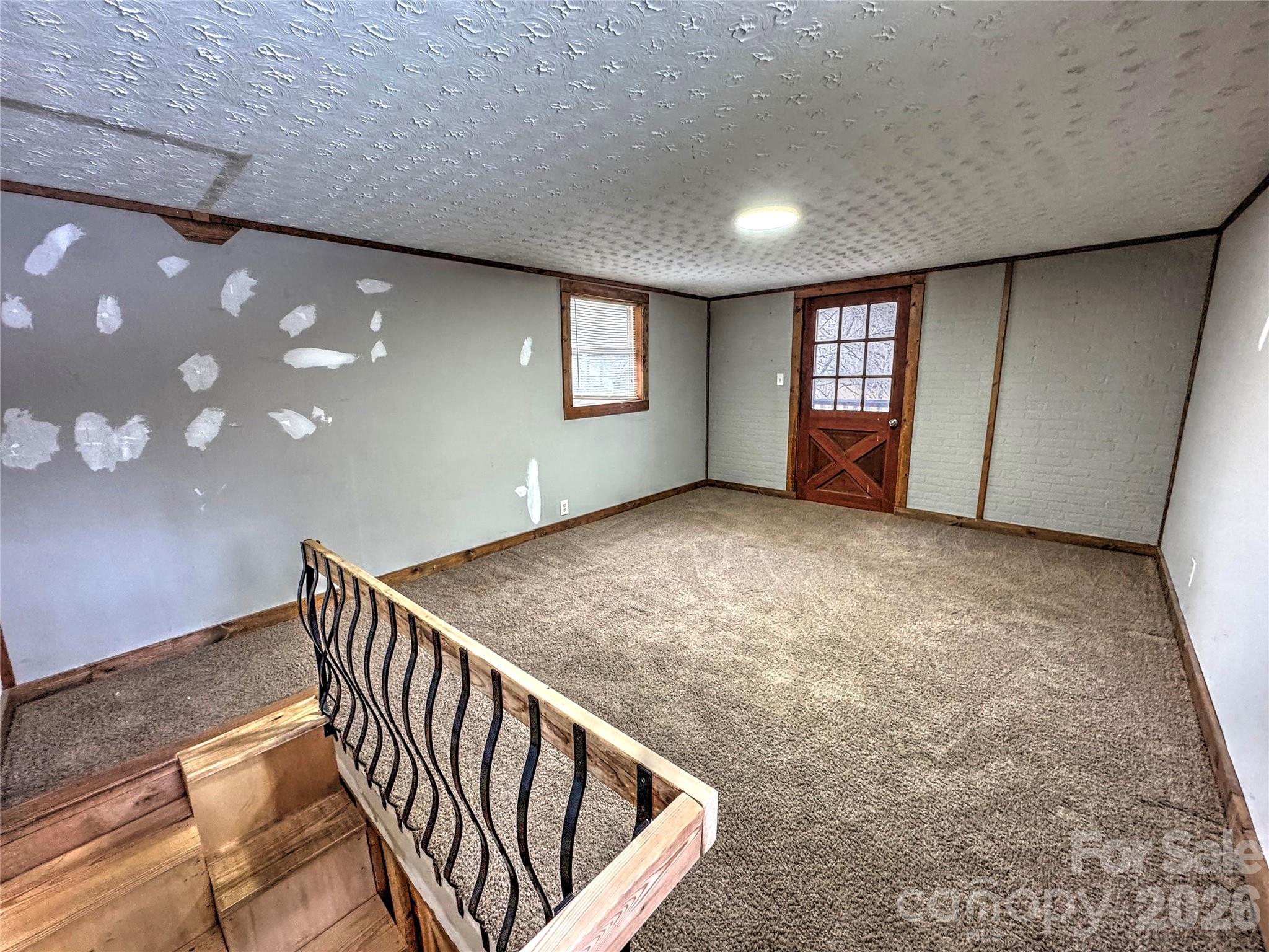 1101 Otter Creek Road Topton, NC 28781 - Photo 21 of 37 a view of an empty room with windows