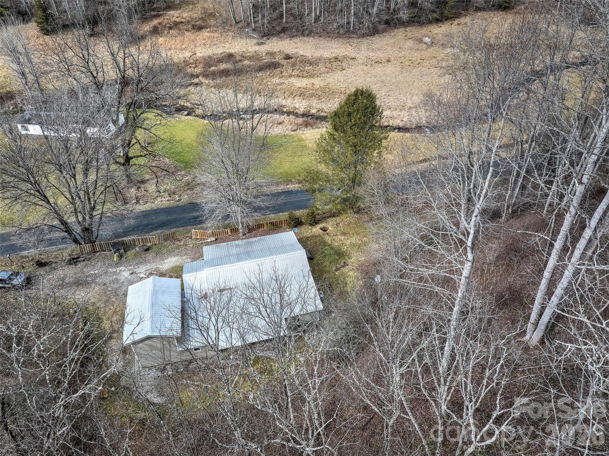 1101 Otter Creek Road Topton, NC 28781 - Photo 10 of 37 a backyard of a house with lots of green space