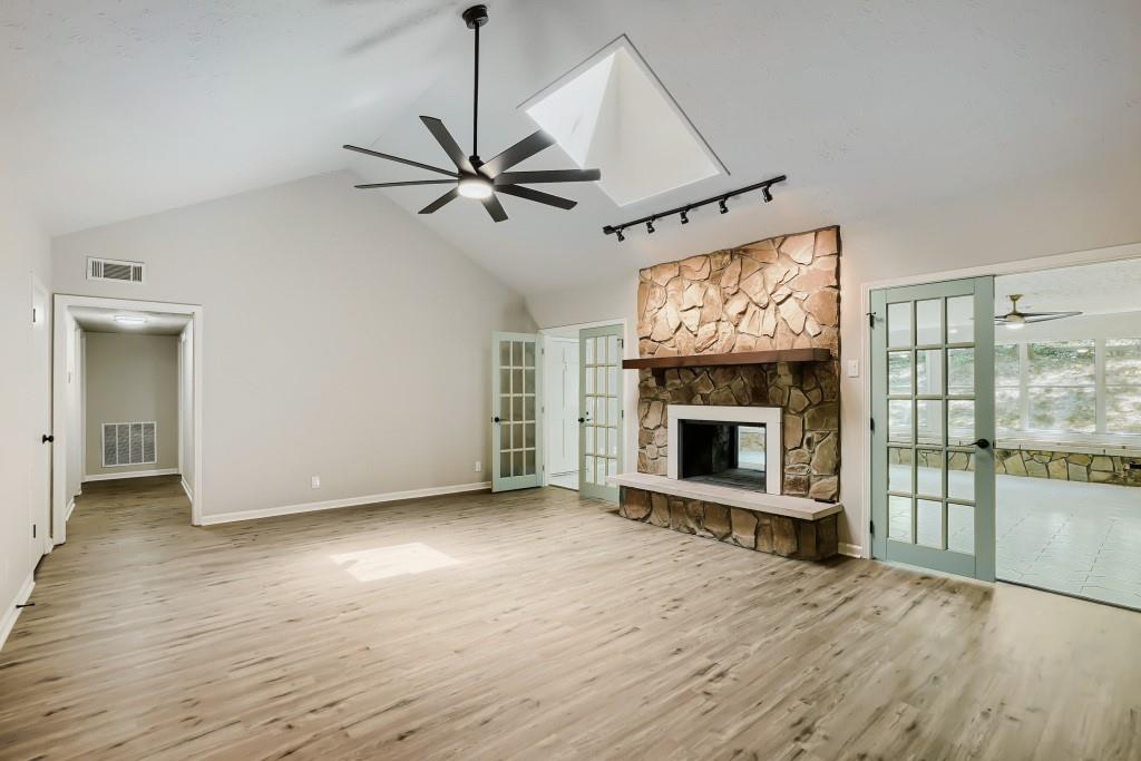 2021 Irwin Bridge Road Northwest Conyers, GA 30012 - Photo 18 of 43 a view of a livingroom with a fireplace and window