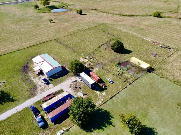 a aerial view of a house with a yard