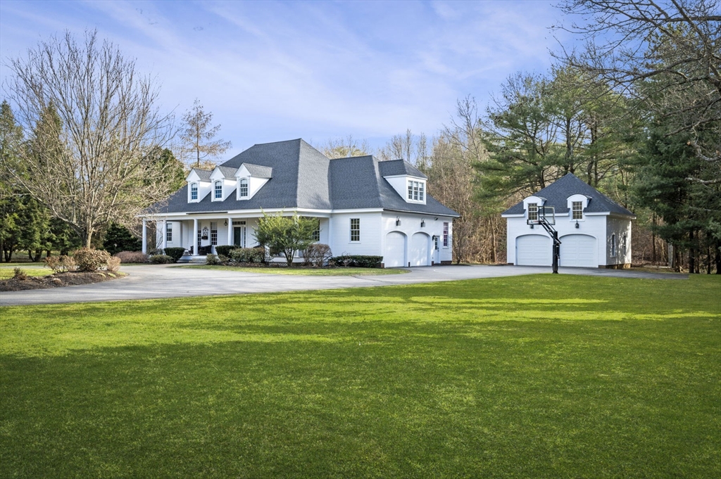 a front view of a building with a garden