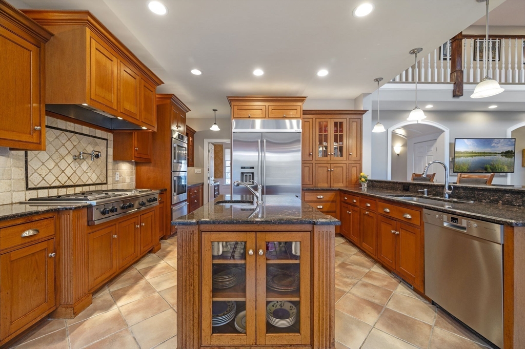 8 Azalea Way Boxford, MA 01921 - Photo 11 of 42 a large kitchen with stainless steel appliances granite countertop a stove and a sink