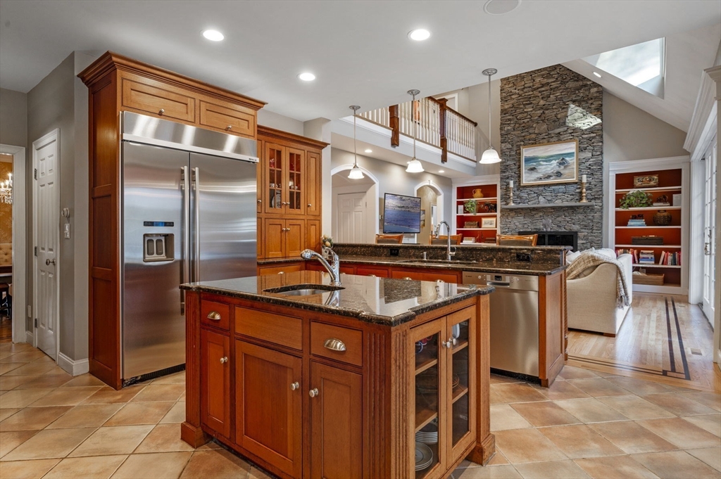 8 Azalea Way Boxford, MA 01921 - Photo 12 of 42 a kitchen with stainless steel appliances granite countertop a stove and a refrigerator
