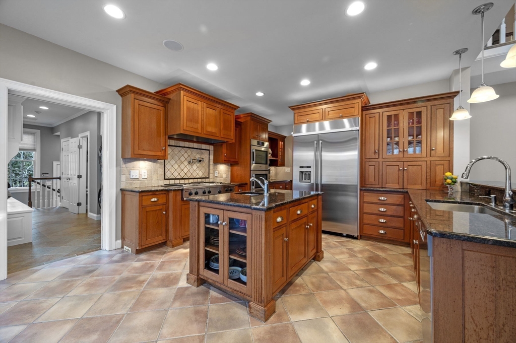 8 Azalea Way Boxford, MA 01921 - Photo 17 of 42 a kitchen with stainless steel appliances granite countertop a stove top oven and cabinets