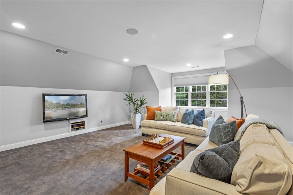 8 Azalea Way Boxford, MA 01921 - Photo 30 of 42 a living room with furniture and a flat screen tv