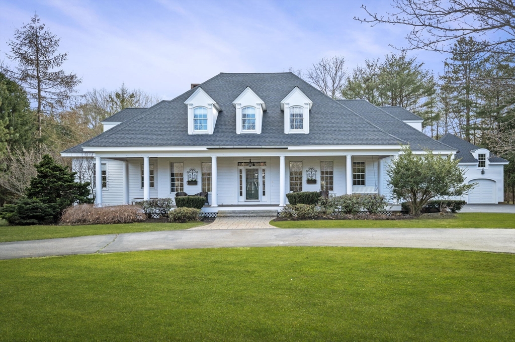 8 Azalea Way Boxford, MA 01921 - Photo 42 of 42 a front view of a house with swimming pool having outdoor seating