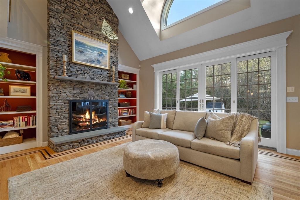8 Azalea Way Boxford, MA 01921 - Photo 9 of 42 a living room with furniture and a fireplace