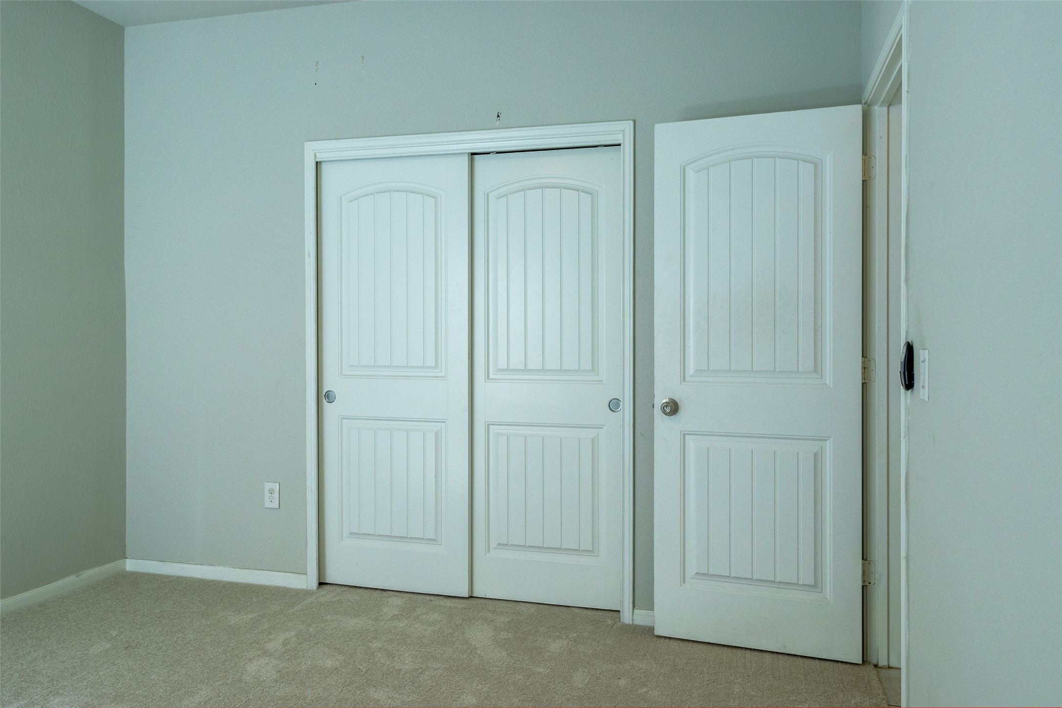 7225 Ranchito Drive Austin, TX 78744 - Photo 19 of 39 Well-maintained bedroom with cozy carpeted floors and a spacious closet, perfect for storage.
