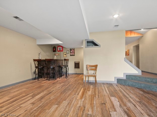 10176 Springfield Road Youngstown, OH 44514 - Photo 16 of 31 Basement featuring light hardwood / wood-style flooring and indoor bar