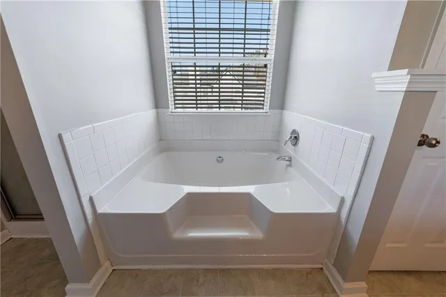 a bathroom with a toilet sink and a shower