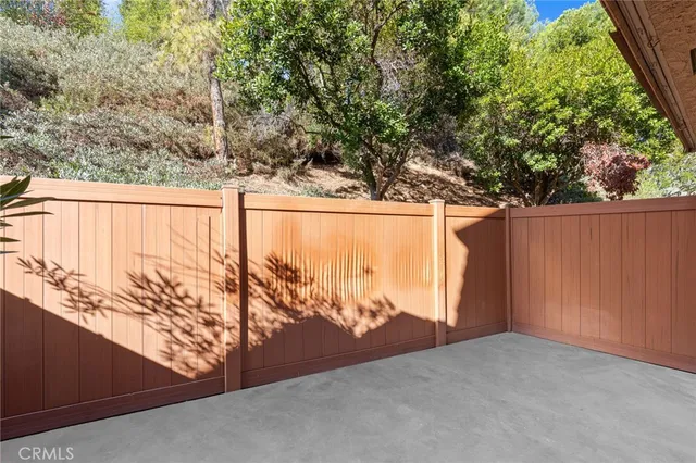 a view of a outdoor space with wooden fence