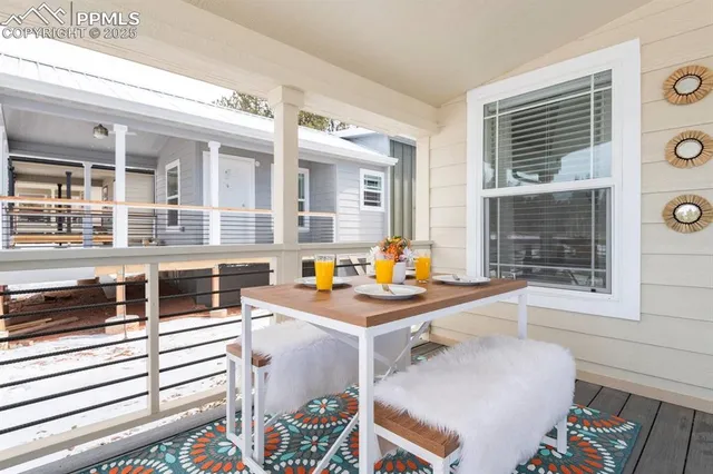 a view of a kitchen with a table and chairs