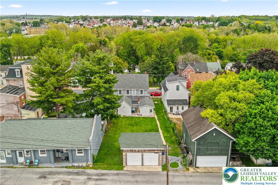 12 South Front Street Coplay, PA 18037 - Photo 39 of 41 An aerial view captures the verdant surroundings and residential structures of this neighborhood.