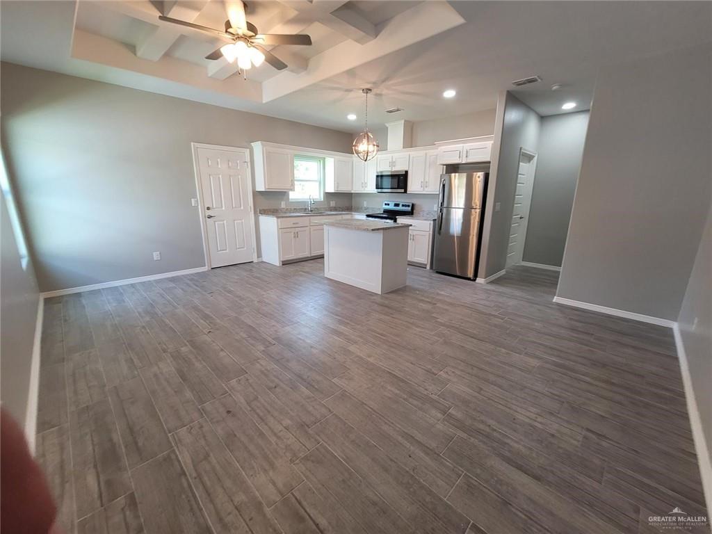 1913 Davenport Street, Unit 2 Weslaco, TX 78596 - Photo 13 of 13 a view of a kitchen with a sink and a refrigerator