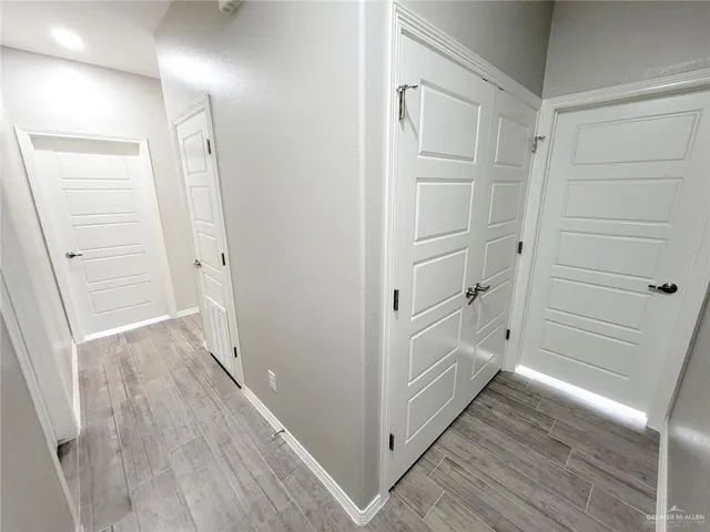 a view of a kitchen with a sink and a refrigerator