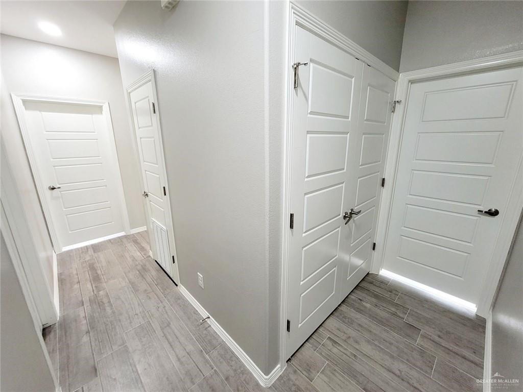 1913 Davenport Street, Unit 2 Weslaco, TX 78596 - Photo 3 of 13 a view of hallway with wooden floor