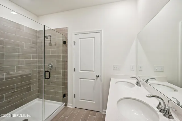 a bathroom with a sink and a shower