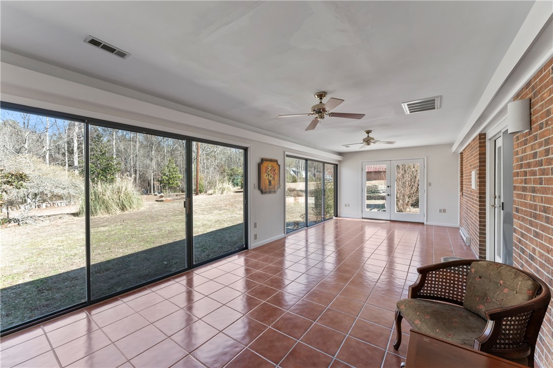 501 Westminster Drive Pendleton, SC 29670 - Photo 8 of 50 Bright Sunroom offers expansive views and versatile indoor-outdoor living.