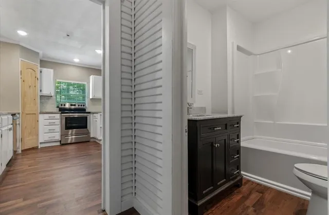 a view of a kitchen from the hallway