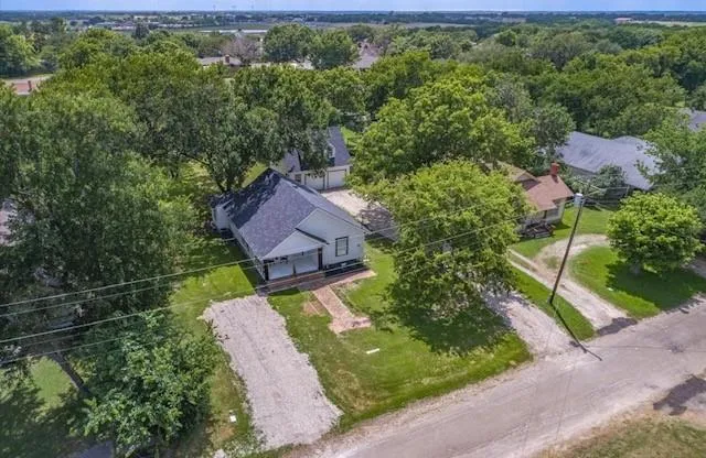 an aerial view of a house with a garden