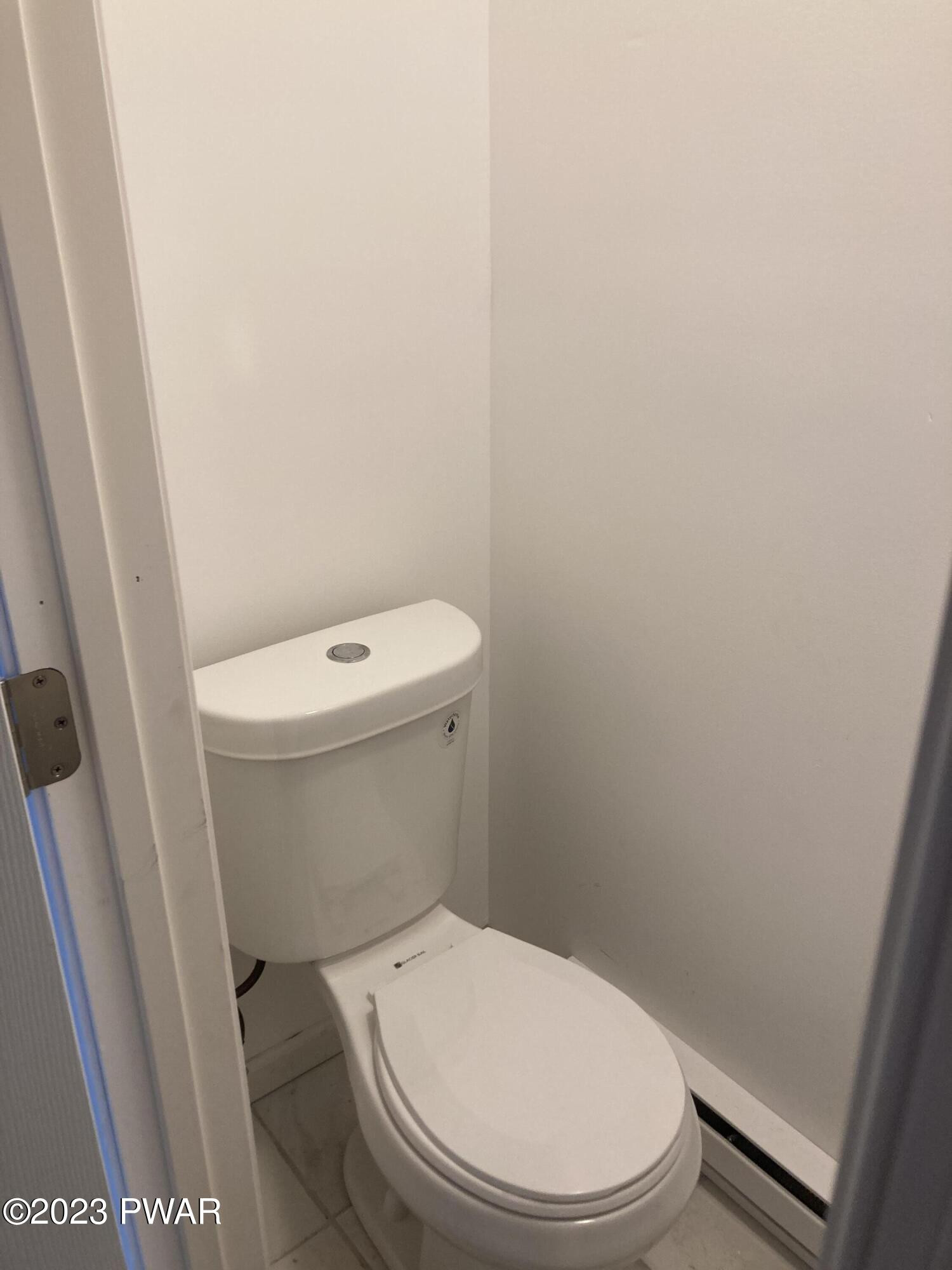 123 Butternut Road Milford, PA 18337 - Photo 11 of 24 a white toilet sitting next to a small sink