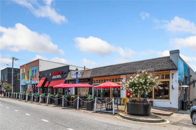 a view of street with sitting area